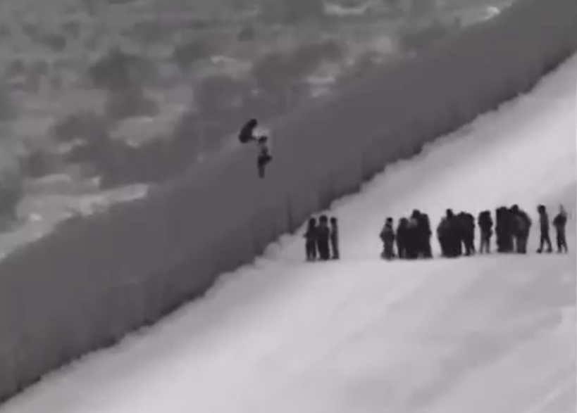 Central American asylum seekers scaling border wall