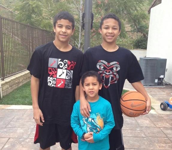 Arizona Cardinals' Michael Wilson with brothers Marcus and Miles
