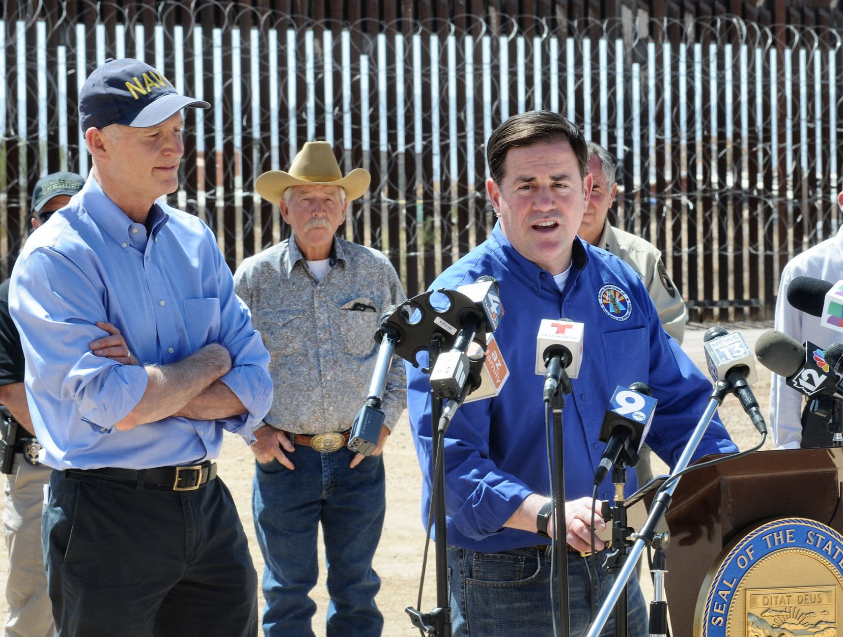 Arizona's governor visits border, declares crisis and blames Biden