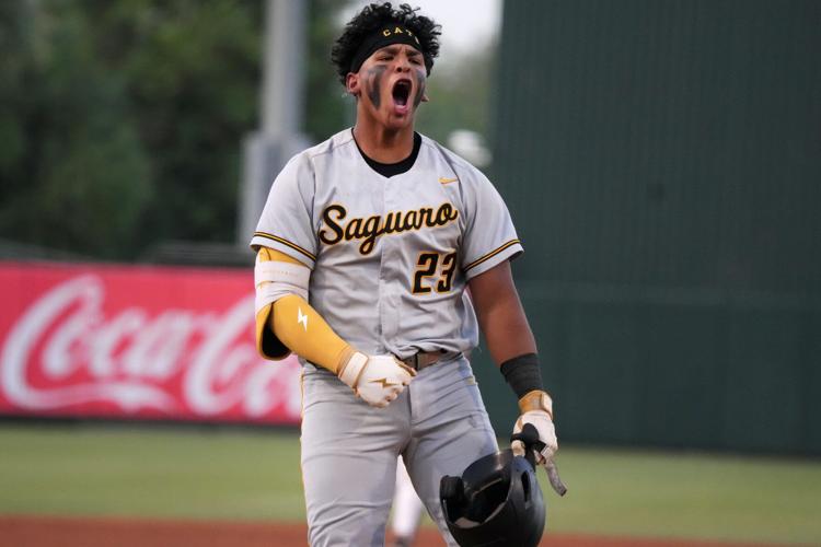 Saguaro Sabercats Alain Gomez-Gudino (23) celebrates his 2-run home run against Gilbert North Eagles during their 4A baseball championship game on May 18, at Tempe Diablo Stadium.