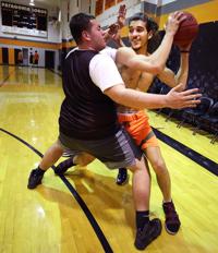 Patagonia boys basketball player Victor Barajas cleaning up on boards