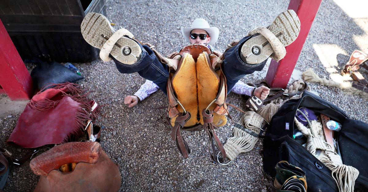 Western boots and a lap or lariat rope and spurs and a cowboy hat