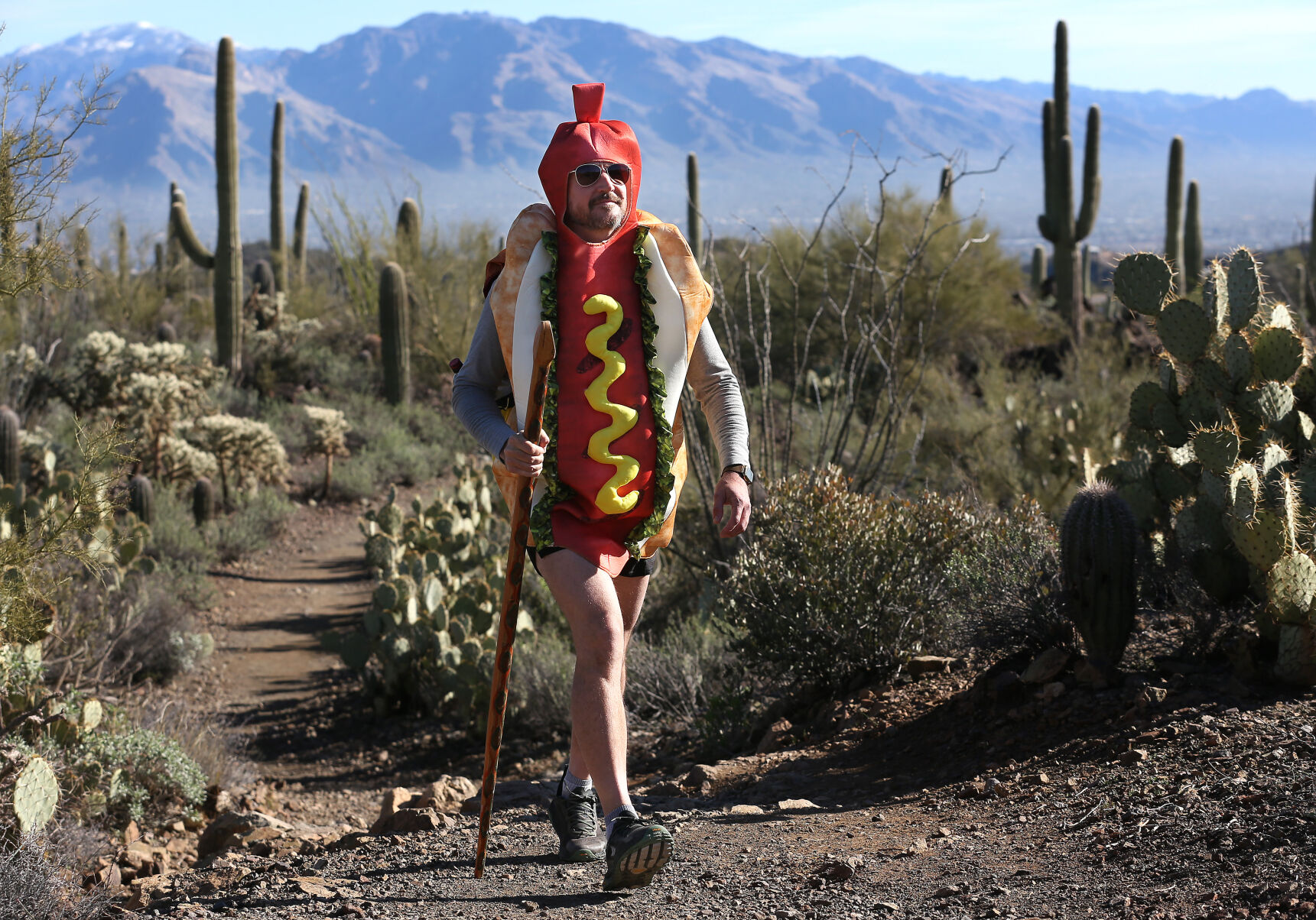 Muralist Joe Pagac is hiking 100 miles in a hotdog costume to