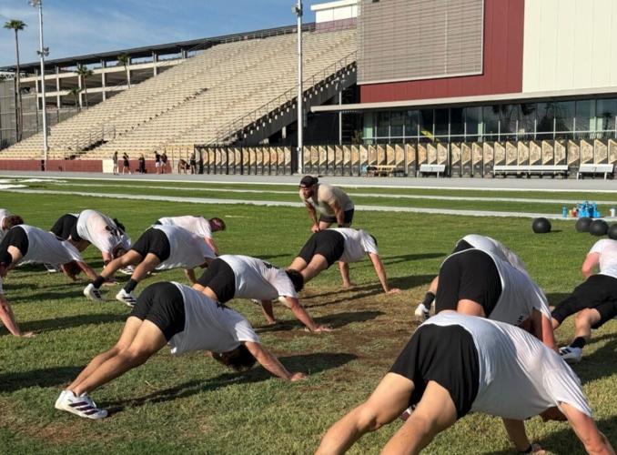 Arizona State University hockey players are shown during an Aug. 20, 2026, workout led by ex-Green Beret Tim Ziesel before a student-athlete collapsed. Matthew Mayich remains hospitalized in a coma.