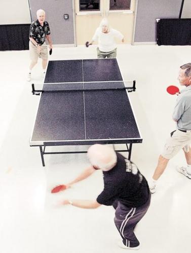 Seniors stay in shape playing table tennis  