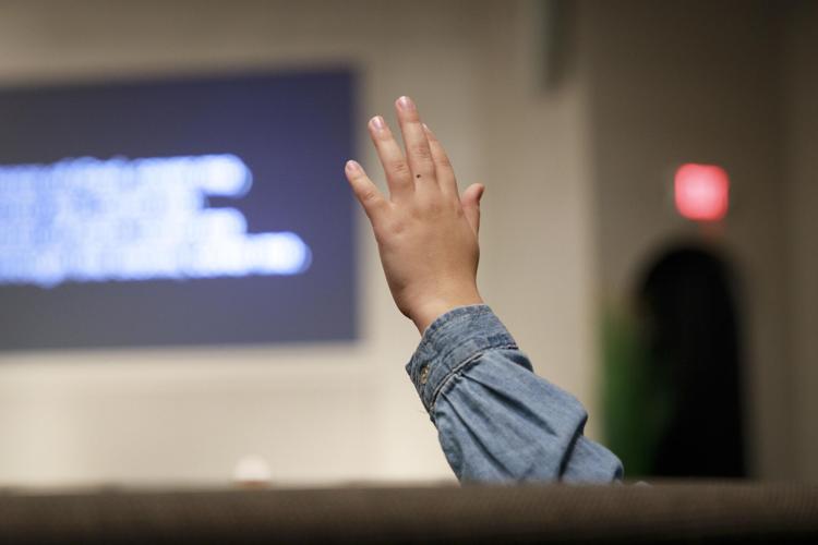 Girl raising hand up