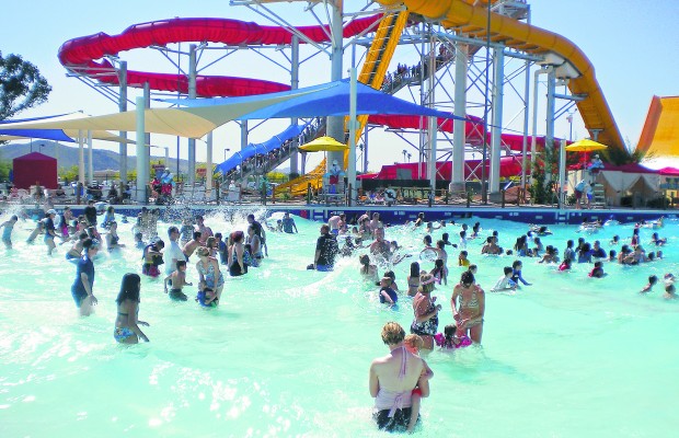 Water slides' swirls, twirls slamming fun