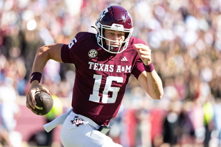 Texas A&M Aggies quarterback Miles O'Neill (16) runs with the ball in the second half of a game at Kyle Field.