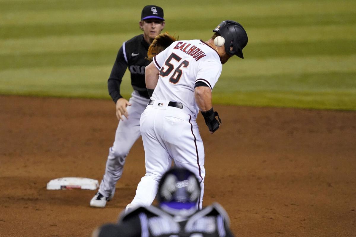 Late surge helps Rockies beat D-backs, end skid