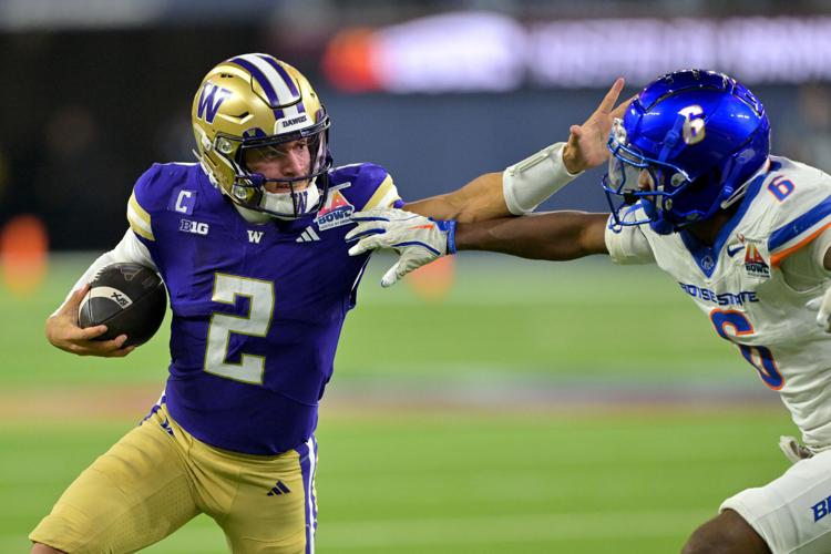 Dec 13, 2025; Inglewood, CA, USA; Washington Huskies quarterback Demond Williams Jr. (2) is forced out of bounds by Boise State Broncos defensive back Jeremiah Earby (6) after a catching a pass in the second half of the LA Bowl at SoFi Stadium. Mandatory