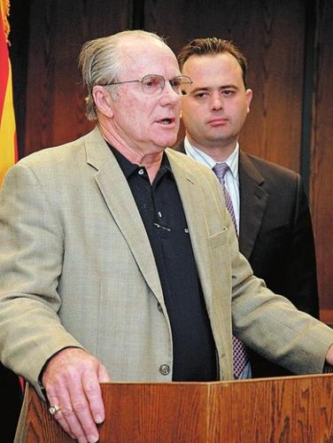 State budget talks stall as suit is threatened  