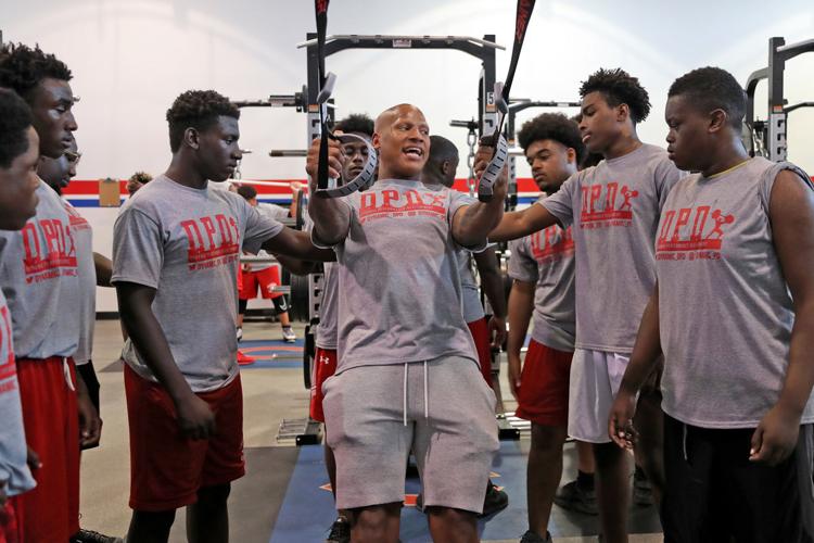 Ryan Shazier shows Plantation High School football players proper form in the weight room during Dynamic Performance Development's summer training camp at Plantation High School on Monday, June 24, 2019.