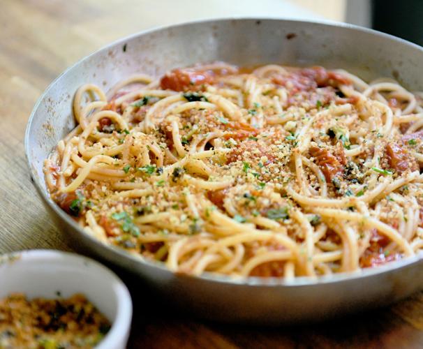 Juicy cherry tomatoes sautéed with garlic until they burst are the base of this easy, seasonal sauce flavored with anchovies and capers.