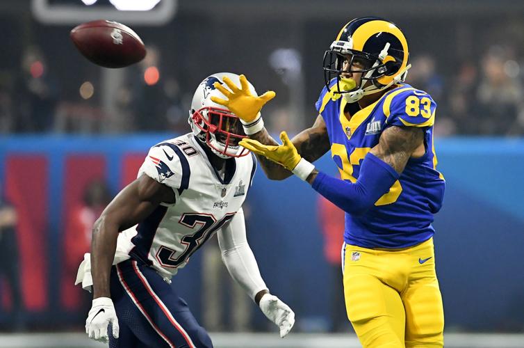 Los Angeles Rams receiver Josh Reynolds (83) makes a catch in front of the New England Patriots' Jason McCourty in the third quarter during Super Bowl LIII at Mercedes-Benz Stadium in Atlanta on Sunday, Feb. 3, 2019. The Patriots won, 13-3.