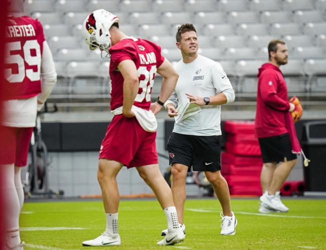 Cardinals head coach Mike LaFleur walks the field as players warm up during training camp at State Farm Stadium in Glendale on July 30, 2026.
