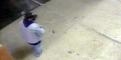 Photo shows man in front of Tucson tattoo shop prior to fire