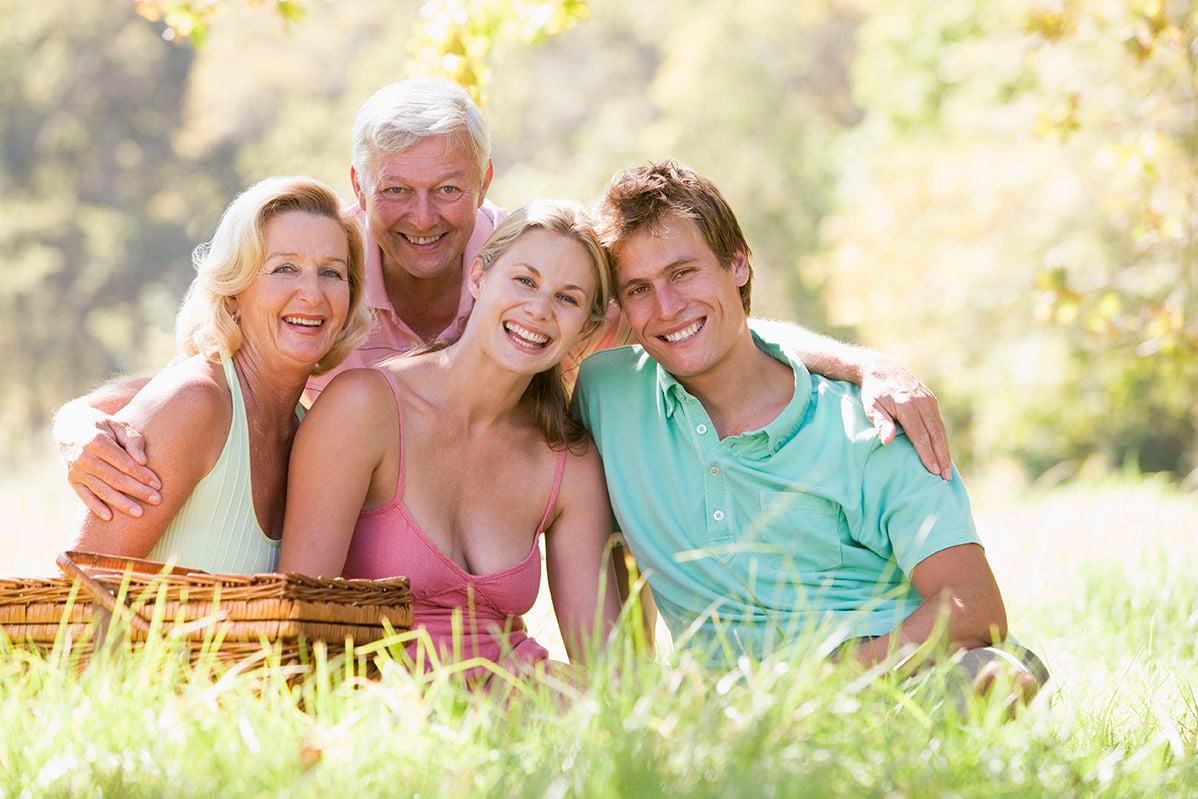 Parents with adult children on picnic