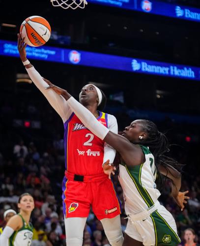 Mercury guard Kahleah Copper (2) goes up for a layup against the Storm during a game at the Mortgage Matchup Center in Phoenix,