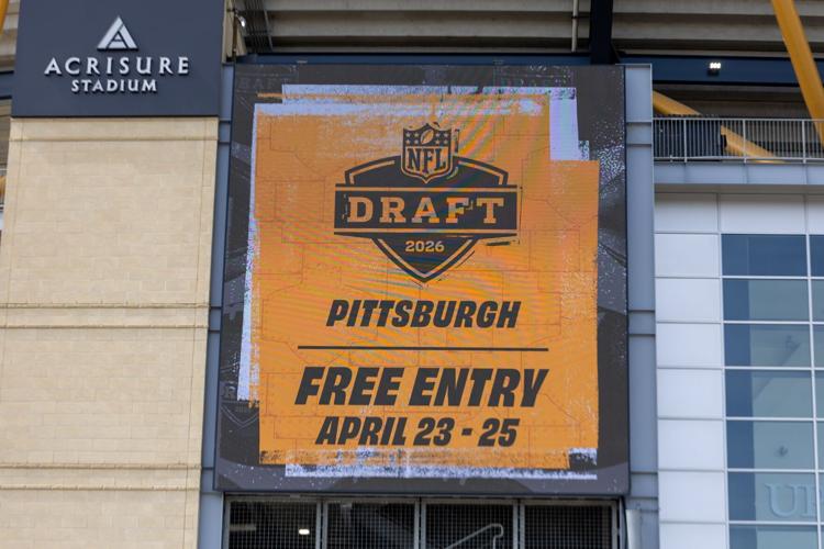 An advertisment for the 2026 NFL Draft is displayed on a video board outside Acrisure Stadium, Wednesday, March 25, 2026 in