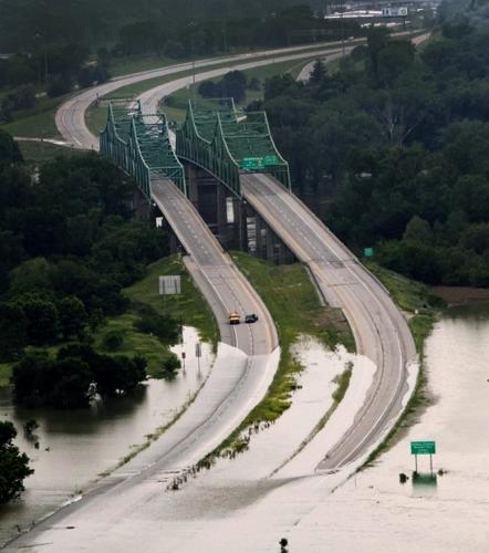 Urgent race to add to levee is vital to Iowa town   