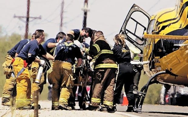 Officer on life support after crosstown pursuit  