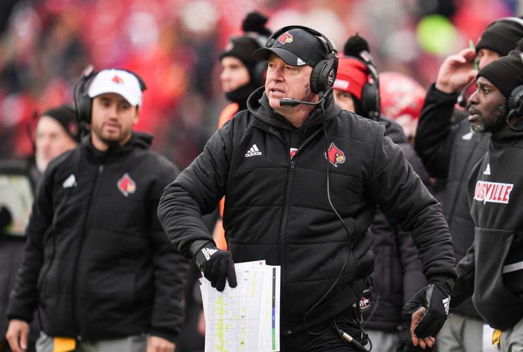 Louisville football coach Jeff Brohm walks on the sideline during his team's game against Kentucky at L&N Federal Credit Union Stadium.