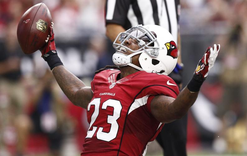 Arizona Cardinals running back Chris Johnson reacts after scoring a touchdown against the San Francisco 49ers in the first half