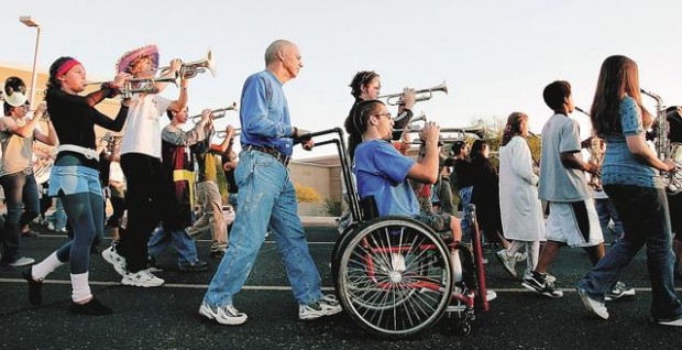 Dad-powered wheelchair aids teen in marching band  