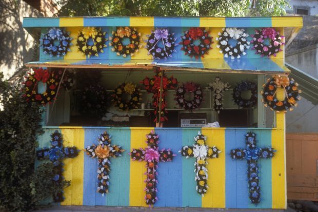 A booth selling coronas and crosses