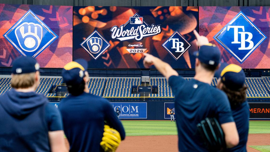 Tutorial Image Fly Game Milwaukee Brewers players point towards a fly ball during a workout and ...