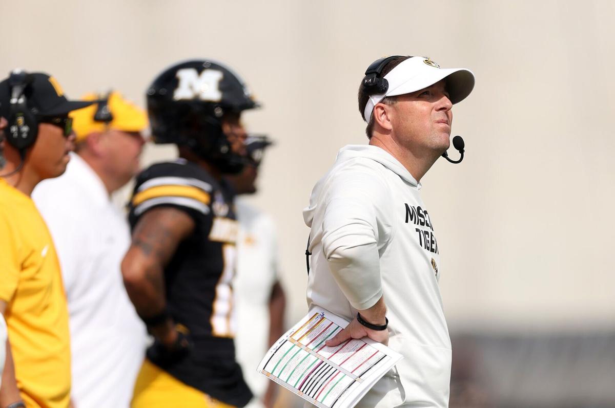 Missouri head coach Eli Drinkwitz, right, watches from the sidelines during action against Alabama at Faurot Field at Memorial Stadium on Oct. 11, 2025, in Columbia, Missouri.