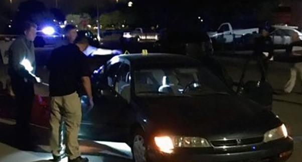 Tucson police ID man found shot to death in running car