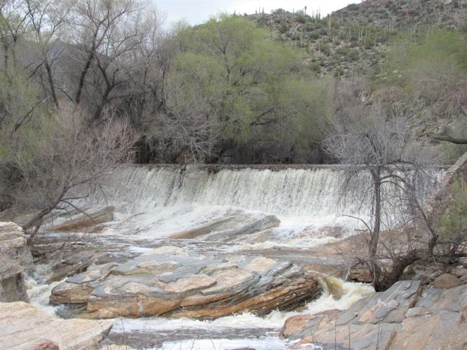 Water flowing over dam