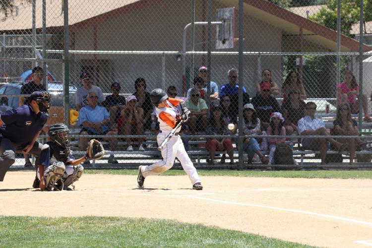 A photo of Tommy Troy playing baseball as a child.