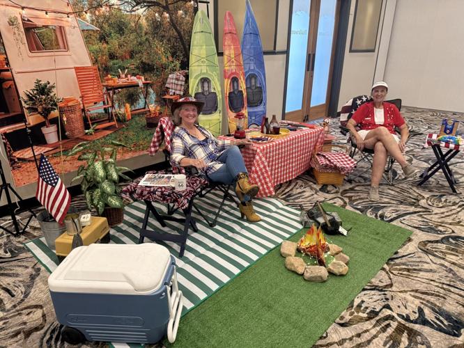Marilyn-Ginther-and-Sue-Virant-sitting-around-the-campfire.jpeg