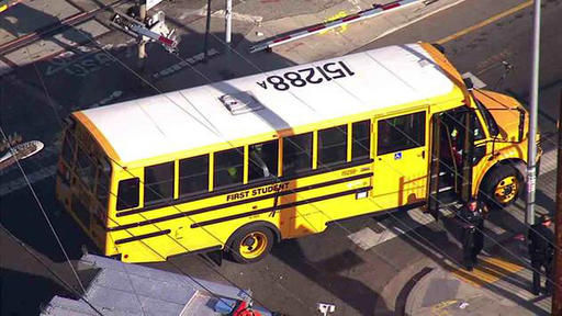 Railroad crossing arm goes through LA school bus windows