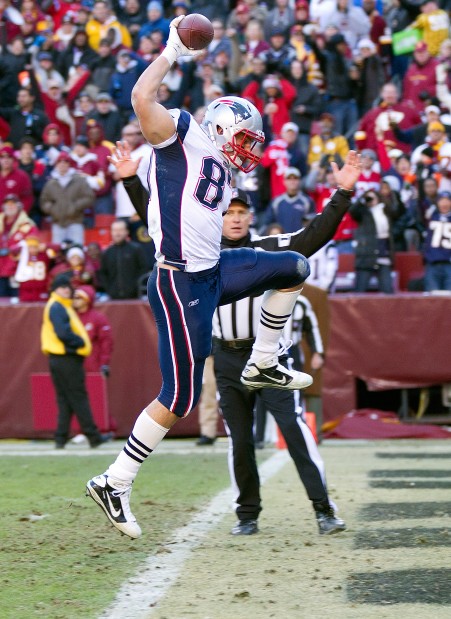 New England Patriots rookie tight end Rob Gronkowski grabs his first NFL  touchdown catch, next to Cincinnati Bengals linebacker Dhani Jones, during  the second half of New England's 38-24 win in an