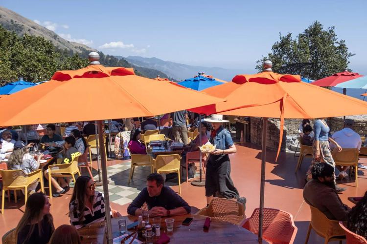 A lunch crowd dines at popular restaurant Nepenthe.