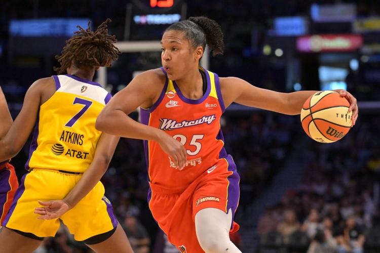 Phoenix Mercury forward Alyssa Thomas (25) as she drives to the basket past Los Angeles Sparks guard Ariel Atkins (7) during the first half at Crypto.com Arena in Los Angeles on July 22, 2026.