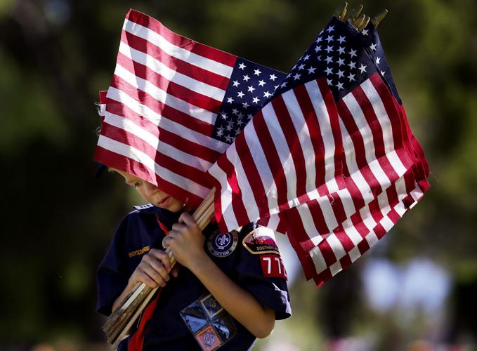Boy Scouts plant Memorial Day flags
