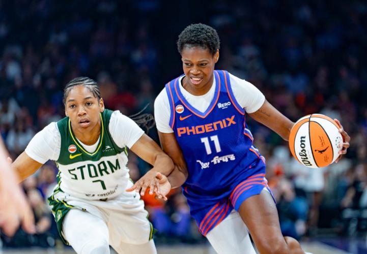 Phoenix Mercury Valeriane Ayayi (11) runs with the ball against Seattle Storm Zia Cooke (7) during a game at Mortgage Matchup Center in Phoenix, on June 20, 2026.