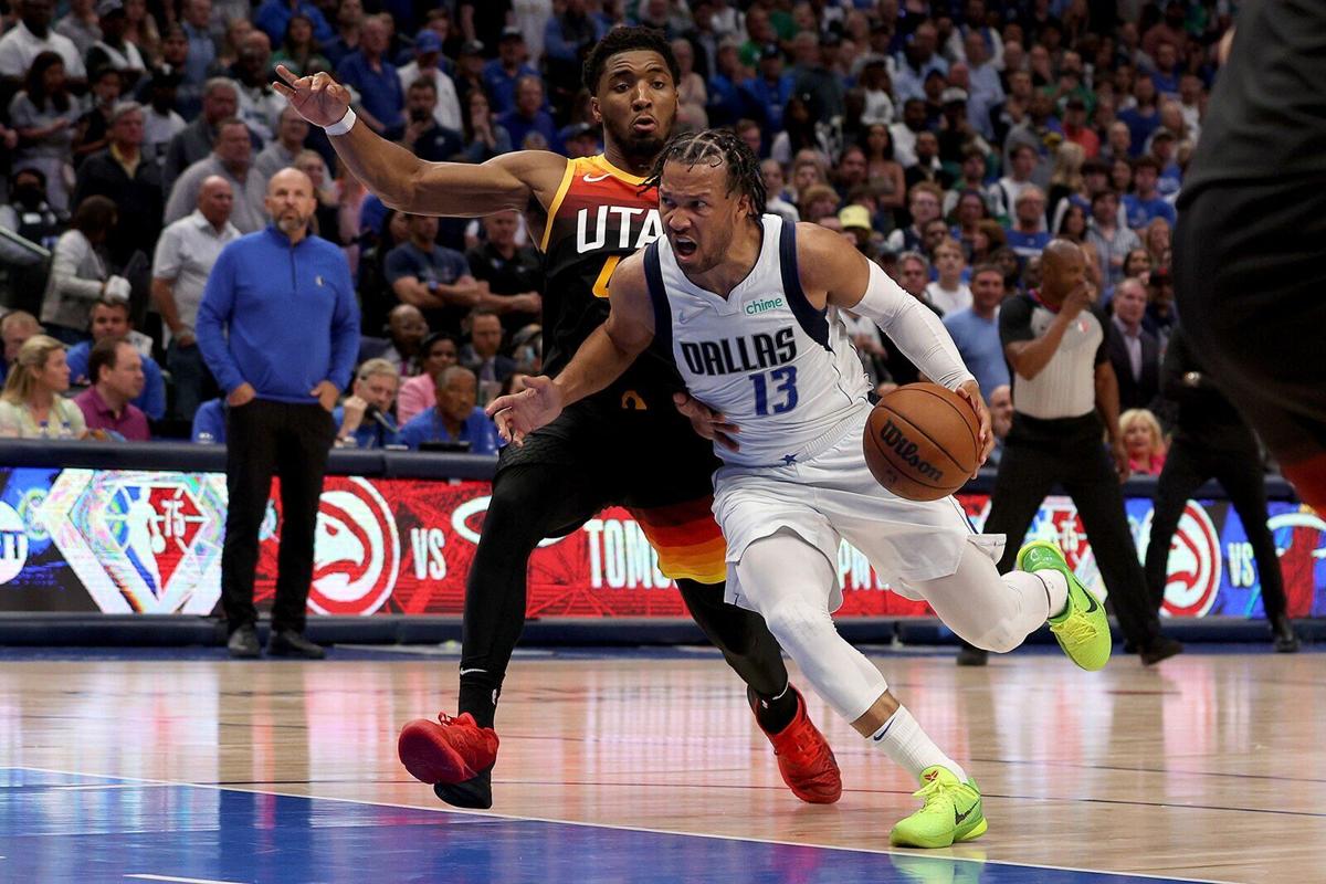 The Dallas Mavericks' Jalen Brunson drives to the basket against the Utah Jazz' Donovan Mitchell in the fourth quarter of Game 2 of the Western Conference first-round playoff series at American Airlines Center on April 18, 2022, in Dallas.