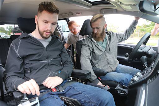 Michigan residents give custom vehicle to paralyzed brothers