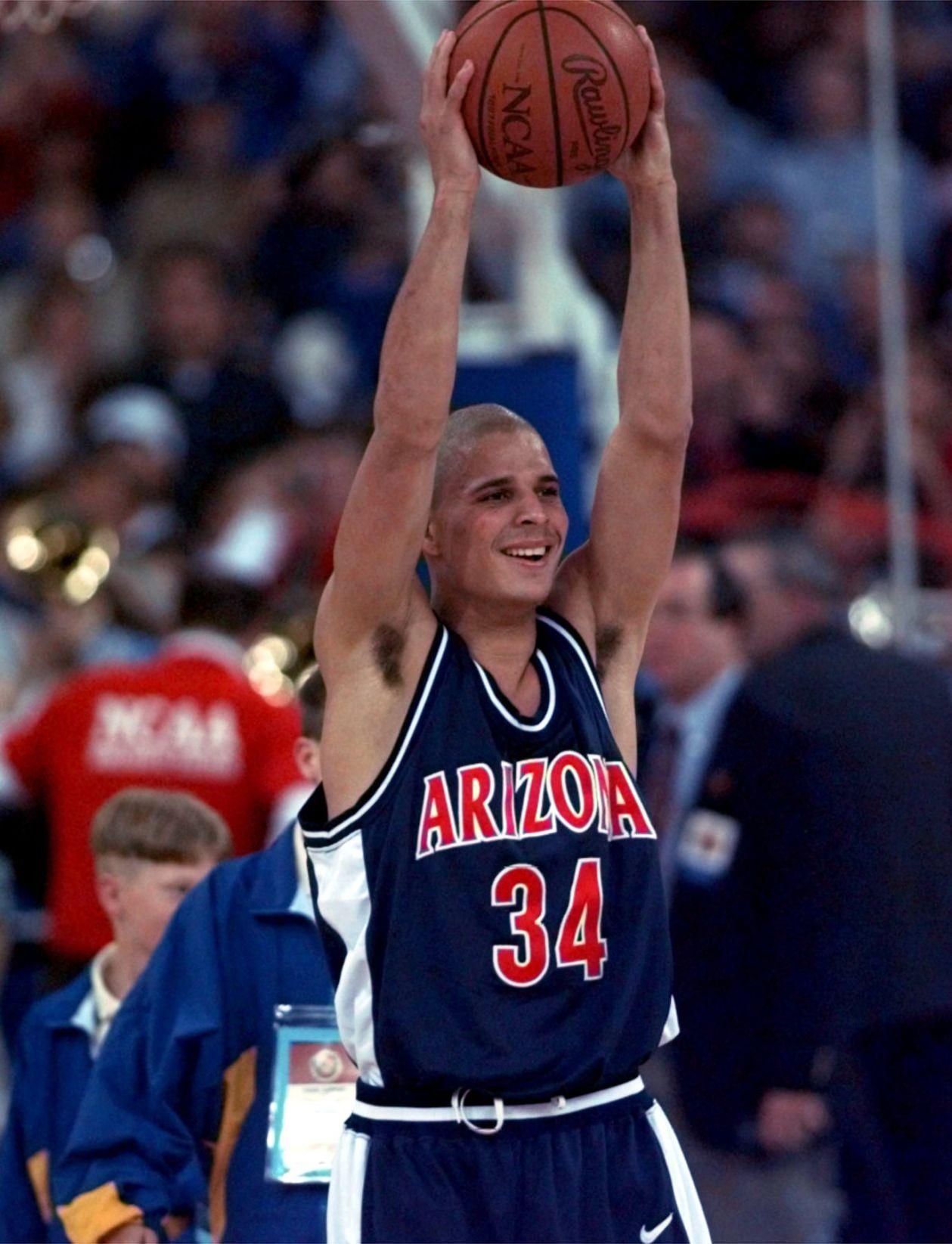 Stars of Arizona’s 1997 title team celebrate during replay of national