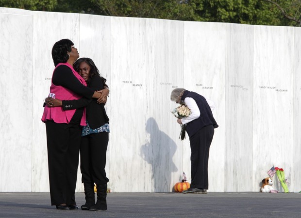 At attack sites, many seek solace, new hope   