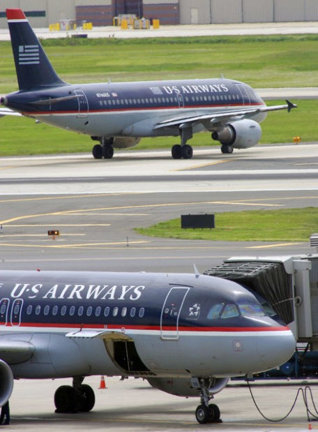 US Airways reverses soda stance: won't charge  