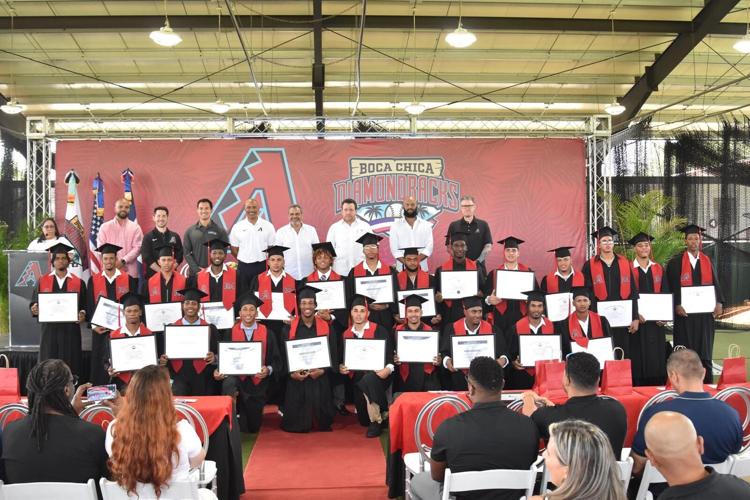 The Arizona Diamondbacks' Class of 2025 and staff pose for a photo during a graduation ceremony in Boca Chica, Dominican Republic.