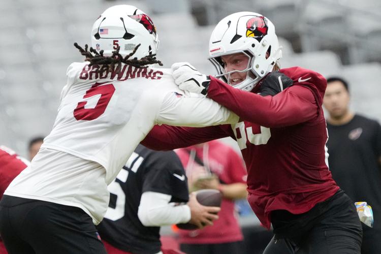 Arizona Cardinals tight end Trey McBride (85) blocks linebacker Baron Browning (5) during training camp at State Farm Stadium in