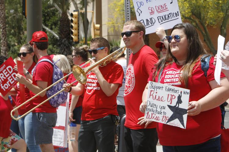 "Support educators who rise up. Ducey, you really have to wise up."