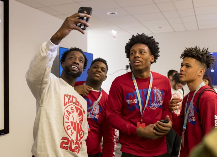 Patrick Beverley poses for a selfie with students.